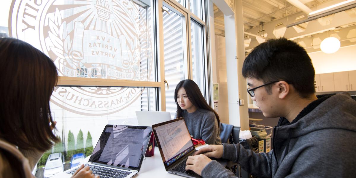 Students study in the atrium of Northwest University's Seattle campus