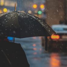 person with an umbrella on a rainy street
