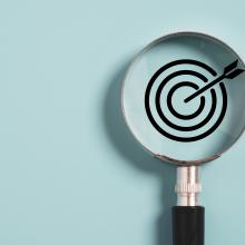 magnifying glass over target